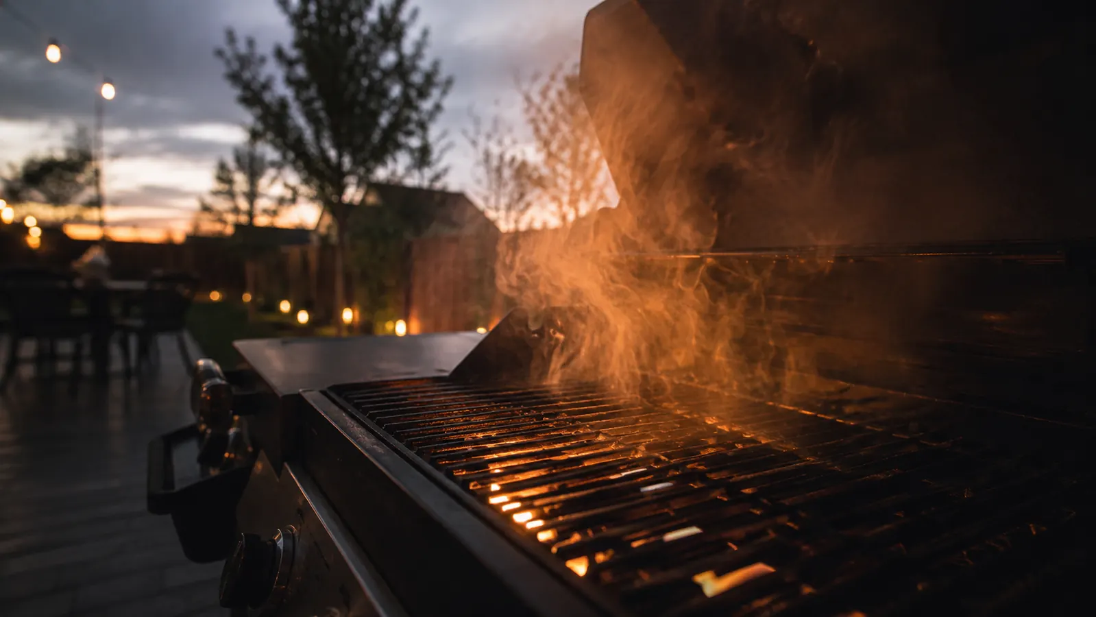 Sliced smoked pork shoulder on a wooden cutting board with a smoke ring visible on the meat